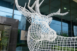 Metal hollow deer sculpture